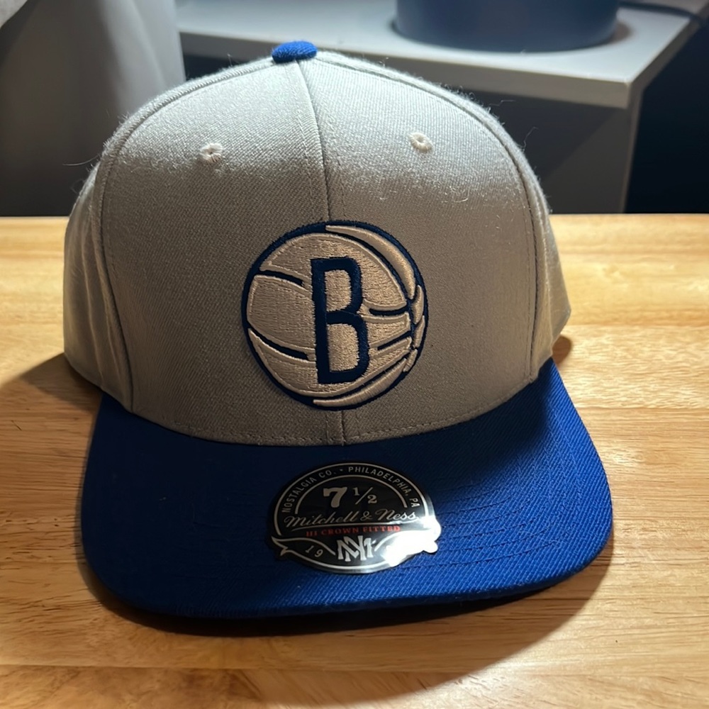 Fitted blue and grey Mitchell & Ness hat. Size 7 1/2 never worn.